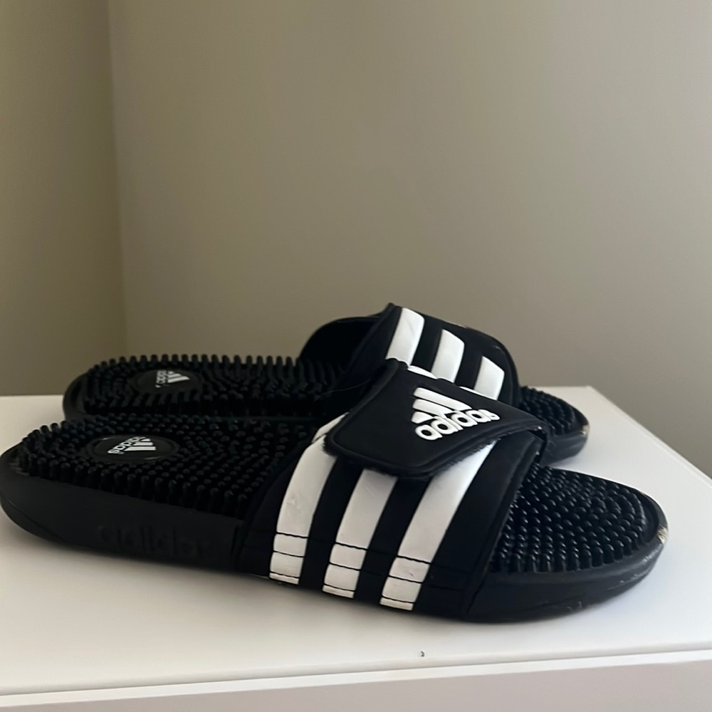 Kids Addidas slides size 4, light wear.